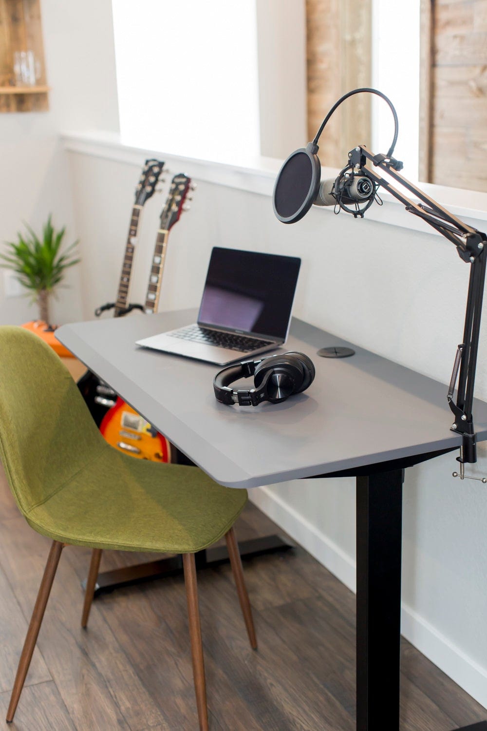 48x24 Charcoal Side Table Fixed height desk in home office with guitar amp and podcast microphone